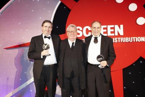 Lifetime Achievement Award: Nigel and Trevor Green, Entertainment Film Distributors (with presenter Alan Parker in centre)